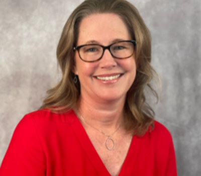 Woman wearing glasses and a red shirt
