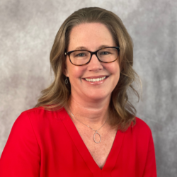 Woman wearing glasses and a red shirt